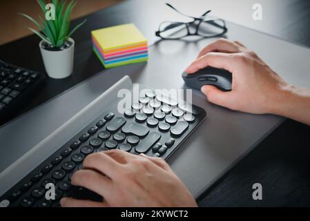 Man using computer mouse. Working at the office Stock Photo