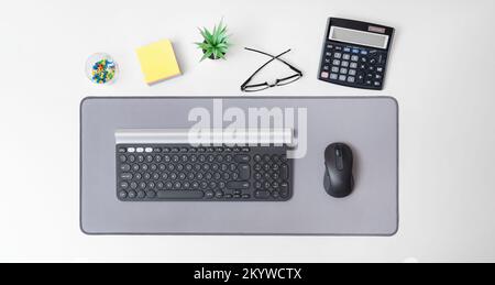 Wireless computer mouse and keyboard. Workspace at the office background, top view Stock Photo