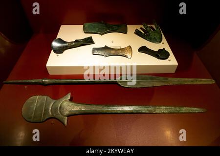 Lugged axe casting, spearhead, crecentric axe. Bronze age axes. Bursa archaeology museum Turkey Stock Photo