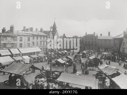 Vintage photograph - 1922 - Market Scene, Curry's Cycles, Smith Furnishing Company, Wood Saddlery, Cornhill, Bury St Edmunds, Suffolk Stock Photo