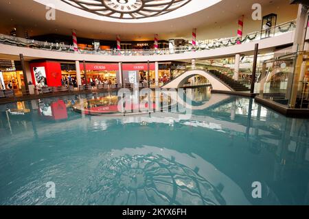 SINGAPORE - NOVEMBER 08, 2015: view on Rain Oculus. Rain Oculus is a large whirlpool forms inside a 70 foot diameter acrylic bowl and falls 2 stories Stock Photo