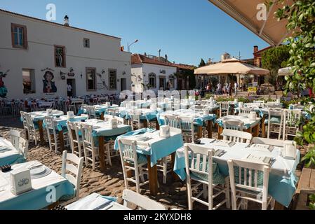 Ayvalik, Turkey - July 19, 2022 : Street view in Cunda Island in Ayvalik. places where people have fun outdoors Stock Photo