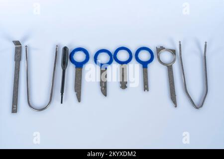 Set of special keys for disassembling stereos of different brands of cars isolated on white background Stock Photo