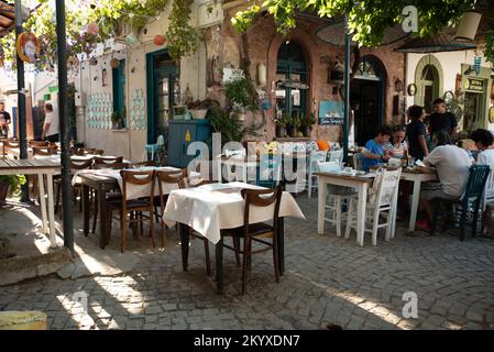 Ayvalik, Turkey - July 19, 2022 : Street view in Cunda Island in Ayvalik. places where people have fun outdoors Stock Photo