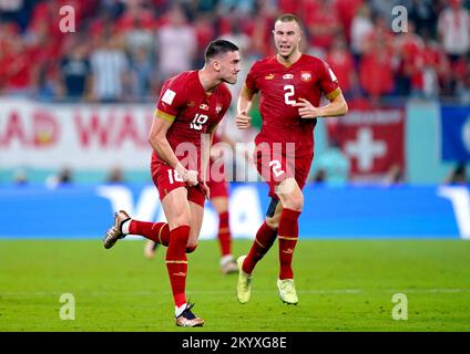 Serbia's Dusan Vlahovic (left) celebrates scoring their side's second goal of the game during the FIFA World Cup Group G match at Stadium 974 in Doha, Qatar. Picture date: Friday December 2, 2022. Stock Photo