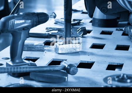 Car repair tools on the table in auto repair shop Stock Photo