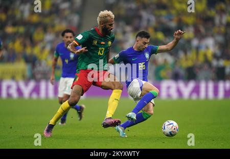 Cameroon's Eric Maxim Choupo-Moting (left) and Brazil's Gabriel Martinelli battle for the ball during the FIFA World Cup Group G match at the Lusail Stadium in Lusail, Qatar. Picture date: Friday December 2, 2022. Stock Photo