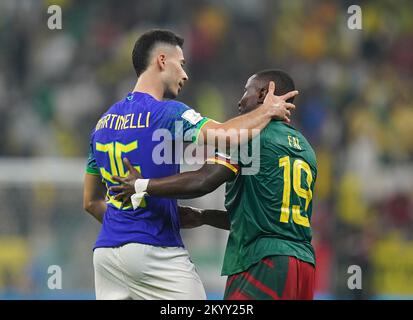 Brazil's Gabriel Martinelli (left) and Cameroon's Collins Fai after the final whistle during the FIFA World Cup Group G match at the Lusail Stadium in Lusail, Qatar. Picture date: Friday December 2, 2022. Stock Photo