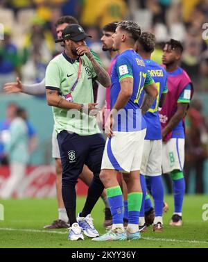 Brazil's Neymar on the pitch with Bruno Guimaraes after the FIFA