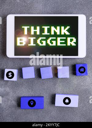 Conceptual display Think Bigger. Word Written on being able to dream and visualise what you can achieve Stock Photo