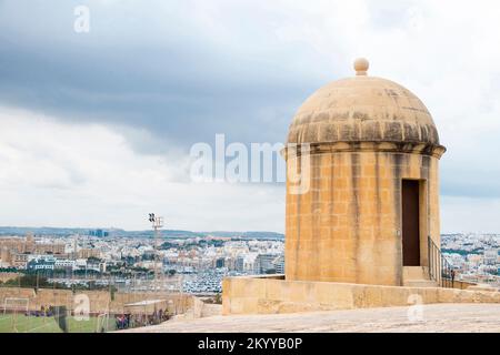 Valletta, Malta - November 12, 2022: 16th century fortification, watch tower, a football pitch,  and view of Msida Yacht Marine, from the St John bast Stock Photo