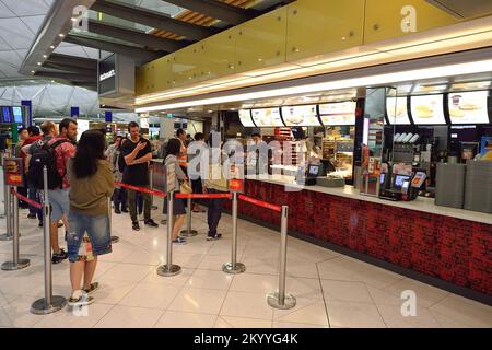 HONG KONG - NOVEMBER 16, 2015: people in the McDonald's restaurant. McDonald's primarily sells hamburgers, cheeseburgers, chicken, french fries, break Stock Photo