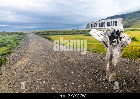Signpost direction to Vik's scenic volcanic black sand beach in Iceland Stock Photo