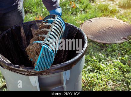 Man holding a Tuf - Tite filter of septic system tank and water wells. Copy space for text. Stock Photo