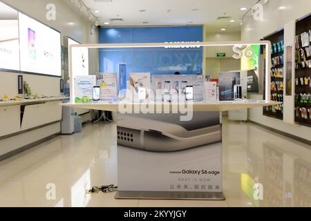 SHENZHEN, CHINA - MAY 25, 2015: interior of store with Samsung gadgets. Samsung is a South Korean multinational conglomerate company headquartered in Stock Photo