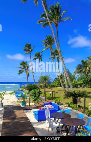 Chairs and tables set up on a beautiful tropical beach. Rarotonga, Cook Islands Stock Photo