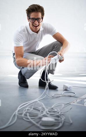 Giving your connection greater distance. A nerd connecting a plug. Stock Photo