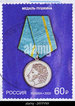 MOSCOW, RUSSIA - OCTOBER 29, 2022: Postage stamp printed in Russia shows Medal of Pushkin, State Awards of the Russian Federation serie, circa 2020 Stock Photo