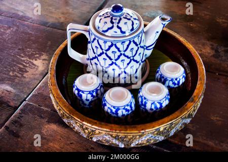 Vintage retro ceramic teapot cup set for tea time to thai people customer and guest travelers drink dining outdoor of cafe shop and restaurant in Song Stock Photo