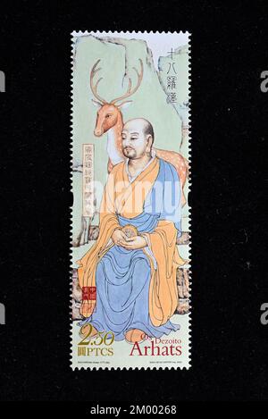 CHINA MACAO - CIRCA 2022: A stamp printed in Macau  shows The Eighteen Arhats, circa 2022. Stock Photo
