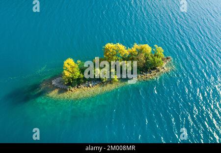 Bird's eye view of the chive island in the turquoise waters of Lake Walen in the canton of St. Gallen, Switzerland, Europe Stock Photo