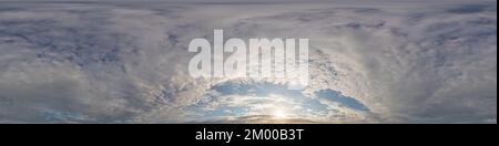 Dark blue sunset sky panorama with golden Cumulus clouds. Seamless hdr 360 panorama in spherical equirectangular format. Full zenith for 3D Stock Photo