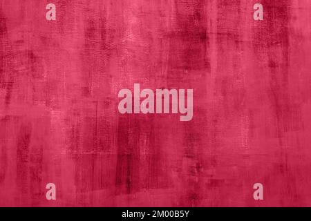 Trendy 2023 Viva Magenta color grungy red background with old cement texture as a wall in retro style. Stock Photo