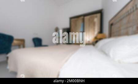 Defocused and blurred photo of luxury and modern bedroom with sea view in hotel apartment interior design. Ideal for background. Stock Photo