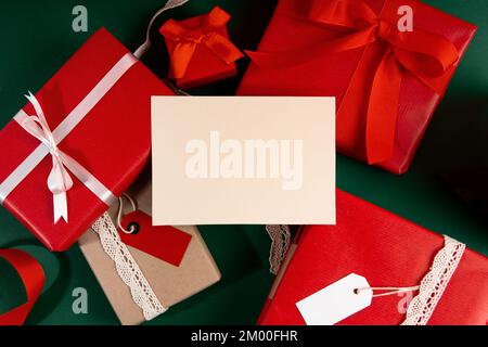 Directly above woman's hand holding mockup postcard with presents Stock Photo