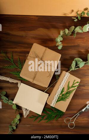 Small business boxes with white postcard over a wooden surface Stock Photo