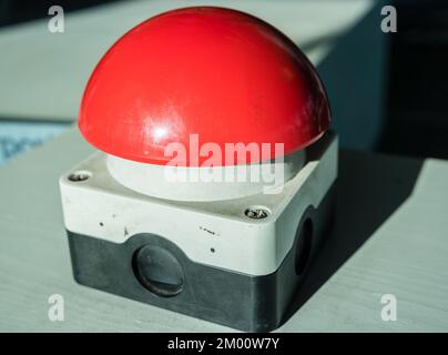 Red emergency stop button in a factory Stock Photo