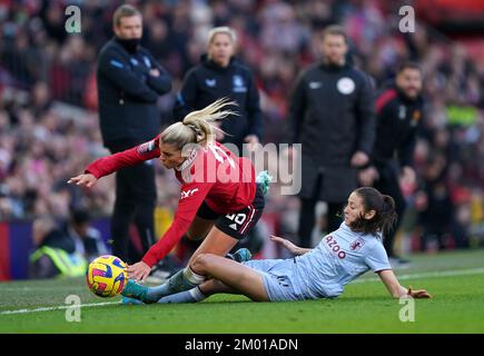 Manchester United's Alessia Russo (left) is tackled by Aston Villa's Danielle Turner during the Barclays Women's Super League match at Old Trafford, Manchester. Picture date: Saturday December 3, 2022. Stock Photo