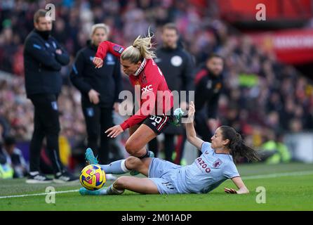 Manchester United's Alessia Russo (left) is tackled by Aston Villa's Danielle Turner during the Barclays Women's Super League match at Old Trafford, Manchester. Picture date: Saturday December 3, 2022. Stock Photo