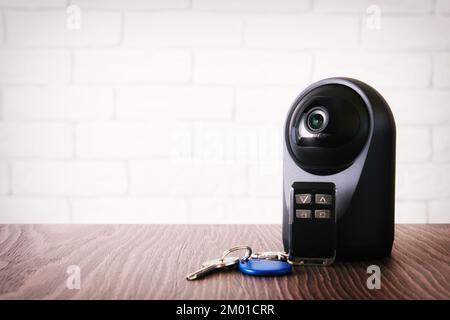 Wireless IP webcam with a motion detection and keys for home access. Safety and house control Stock Photo