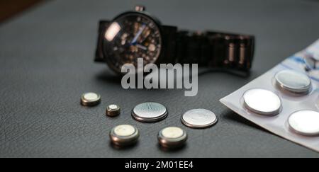 watch batteries for wrist and sports watches on a dark background Stock Photo