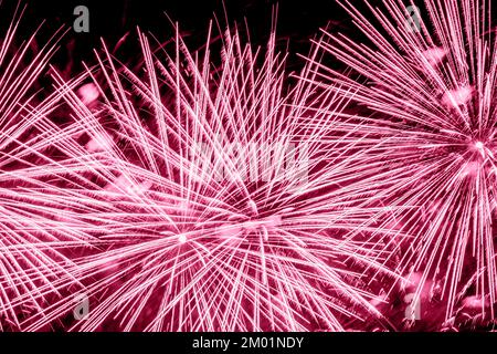 Fireworks in night sky closeup, abstract holiday background, trendy color palette sample Stock Photo