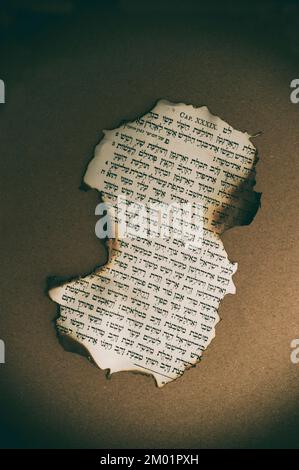 piece of a book in Hebrew , teared and burnt Stock Photo