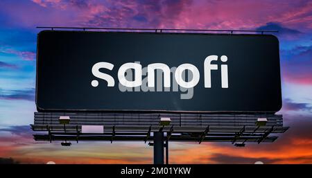POZNAN, POL - OCT 28, 2022: Advertisement billboard displaying logo of Sanofi, a pharmaceutical and healthcare company headquartered in Paris, France Stock Photo