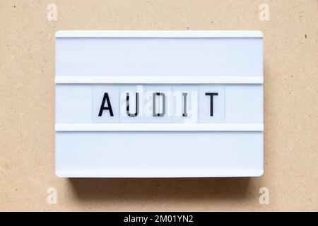 Lightbox with word audit on wood background Stock Photo