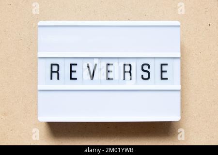 Lightbox with word reverse on wood background Stock Photo