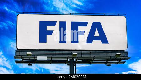 POZNAN, POL - NOV 22, 2022: Advertisement billboard displaying logo of FIFA, an international governing body of association football, beach football a Stock Photo