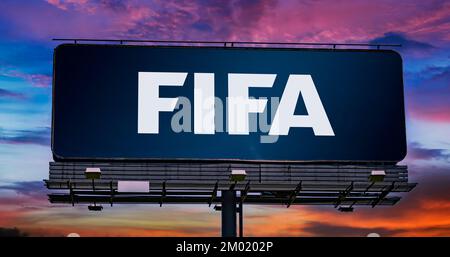 POZNAN, POL - NOV 22, 2022: Advertisement billboard displaying logo of FIFA, an international governing body of association football, beach football a Stock Photo
