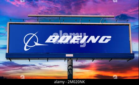 POZNAN, POL - JUN 28, 2022: Advertisement billboard displaying logo of The Boeing Company, an American multinational aerospace corporation Stock Photo