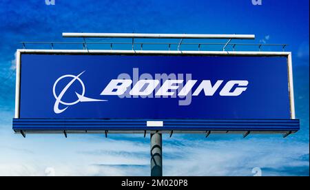 POZNAN, POL - JUN 28, 2022: Advertisement billboard displaying logo of The Boeing Company, an American multinational aerospace corporation Stock Photo