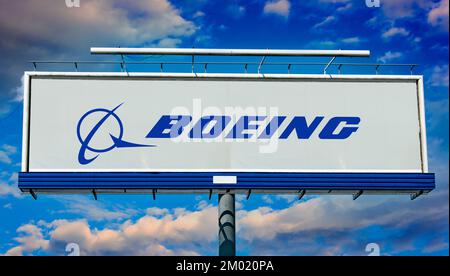 POZNAN, POL - JUN 28, 2022: Advertisement billboard displaying logo of The Boeing Company, an American multinational aerospace corporation Stock Photo