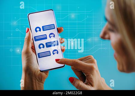 Customer using a chatbot on a smartphone Stock Photo