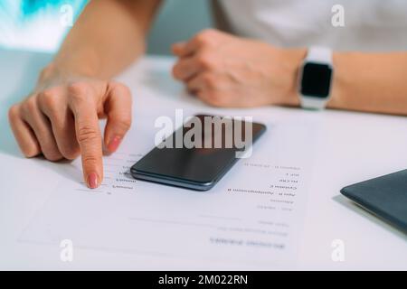 Woman checking blood test results Stock Photo