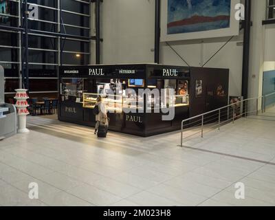Prague, Czech Republic, december 18, 2021: Women buying a cake at french Paul bakery at Vaclav Havel Prague international Airport Stock Photo