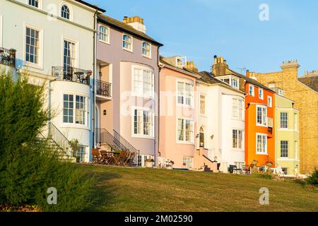 A row of seafront terrace Georgian townhouses along the central Parade on the Herne Bay seafront during golden hour in the morning. Stock Photo