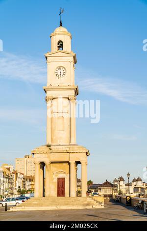 The clock tower on Herne Bay seafront at 6 am in the morning golden hour light. A Grade II listed landmark, the stone tower was erected in 1837. Stock Photo